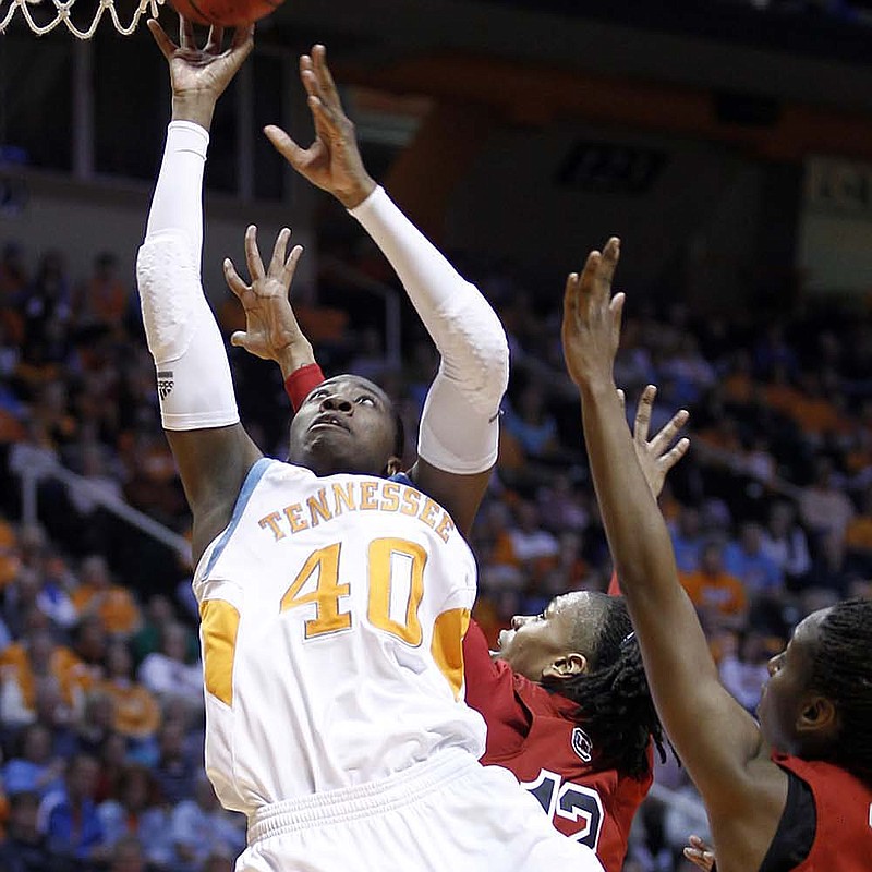 Tennessee’s Shekinna Stricklen (40) shoots as she is fouled by South Carolina’s Charenee Stephens (behind) during the first half of Thursday’s game in Knoxville, Tenn. Stricklen, of Morrilton, finished with 12 points and 10 rebounds as Tennessee won 82-60. 