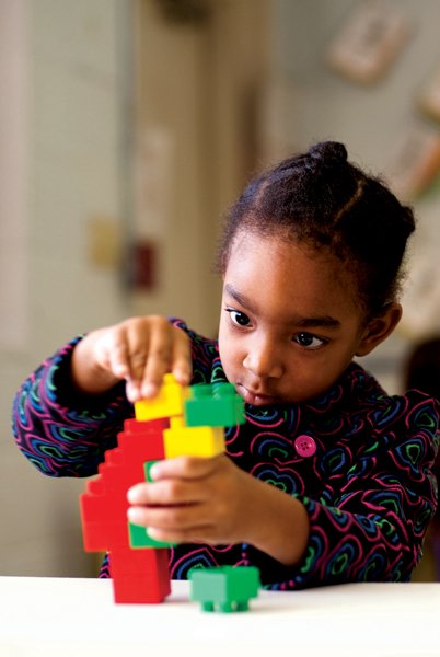Gabrielle Jackson puts blocks together at the H.O.P.E. preschool, a program of the Pine Street Community Development Center, a nonprofit organization celebrating 10 years in Conway. The free preschool is held at the Greater Pleasant Branch Educational Complex in Conway.