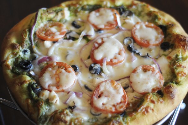 Chicken Pesto pizza is a specialty at The Rail in downtown Rogers.
