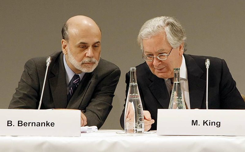 U.S. Federal Reserve Chairman Ben Bernanke and Bank of England head Mervyn King confer Friday in Paris, where Bernanke advised other nations to tackle their trade deficits. 