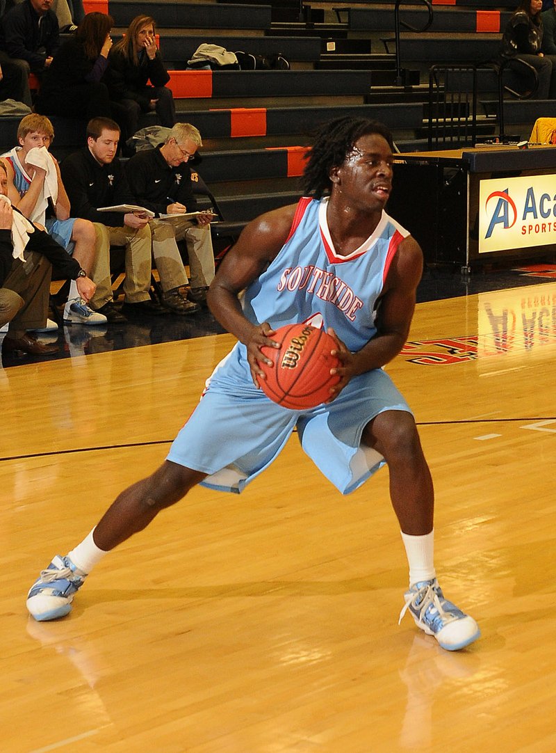  STAFF PHOTO DAVID FRANK DEMPSEY
Fort Smith Southside forward Cameron Adams grabs a rebound and looks for passing room against Heritage at War Eagle Arena in Rogers, Ark. Tuesday, Feb. 8, 2011.