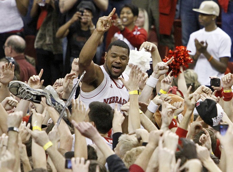 Nebraska’s Lance Jeter celebrates with fans following the Cornhuskers’ 70-67 victory over No. 3 Texas on Saturday at the Bob Devaney Center in Lincoln, Neb.

