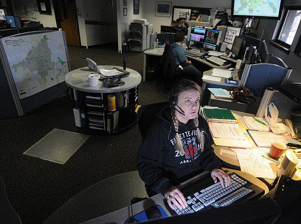 Brianna Fields, a dispatcher servicing Fayetteville police and fire departments, takes an emergency call Friday.