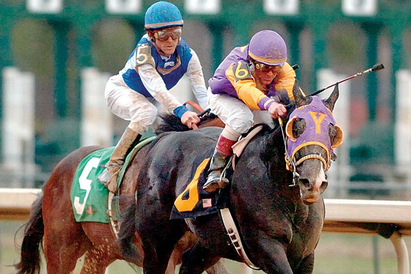 Archarcharch (6), with jockey Jon Court aboard, pulls away from J P’s Gusto and Ramon Dominguez as they near the finish line during the $250,000 Grade III Southwest Stakes on Monday at Oaklawn Park in Hot Springs. Elite Alex, ridden by Calvin Borel, was third. 