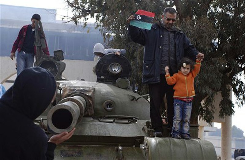 Libyans celebrate Tuesday at the state security camp in Benghazi, which residents said was under protesters’ control. “This is free Libya,” said Amal Bugaigis, 50, a lawyer. 