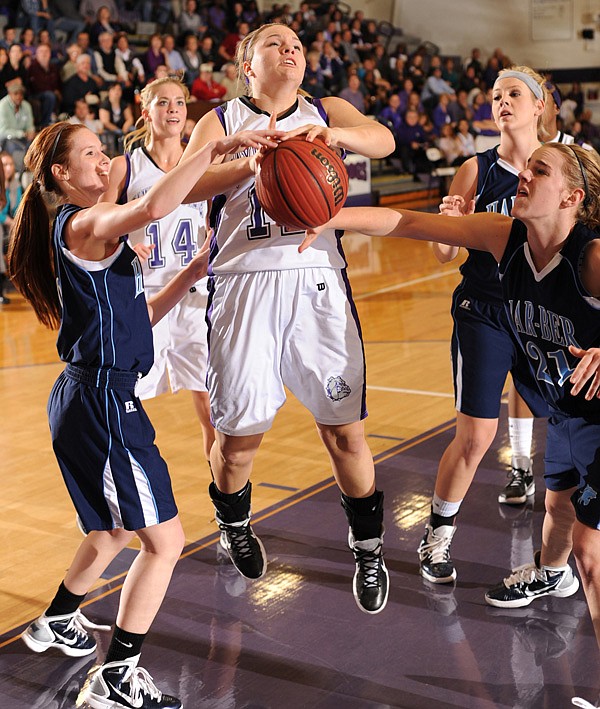 Fayetteville senior Emma Clay, center, has the ball stripped by Springdale Har-Ber senior Chani Wolf, left, and senior Maggie Gartner on Tuesday during the first half of the Lady Bulldogs’ 57-49 win at Fayetteville. Go to <a href="http://nwaonline.com/photoreprints">nwaonline.com/photoreprints</a> to see more photos.