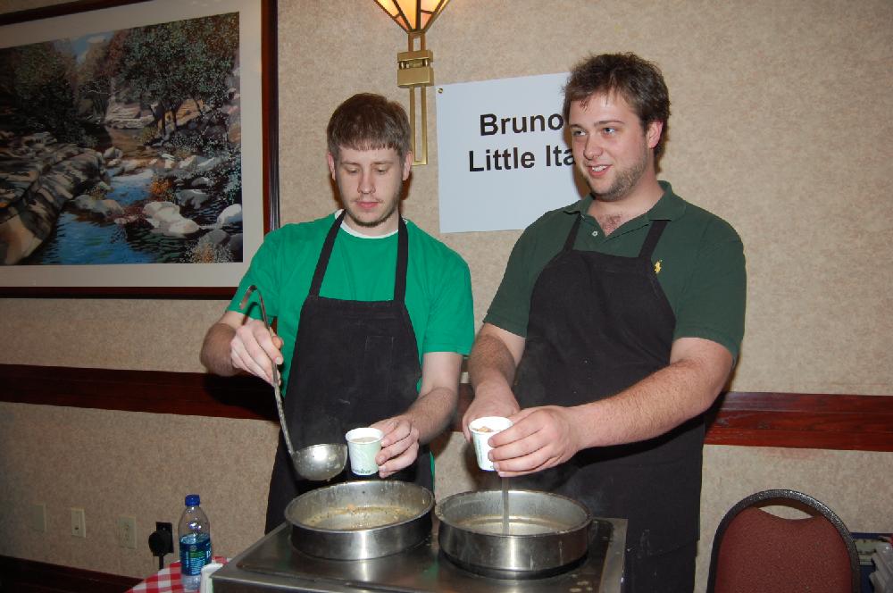 Andrew Gresham and Austin Hill serve soup from Bruno's Little Italy