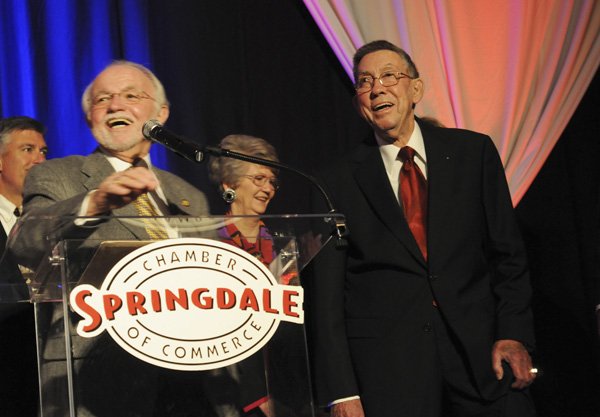 Dick Trammel, left, introduces Bobby Hopper, recipient of the 2011 Civic Service Award during the annual meeting of the Springdale Chamber of Commerce on Thursday at the Northwest Arkansas Convention Center.