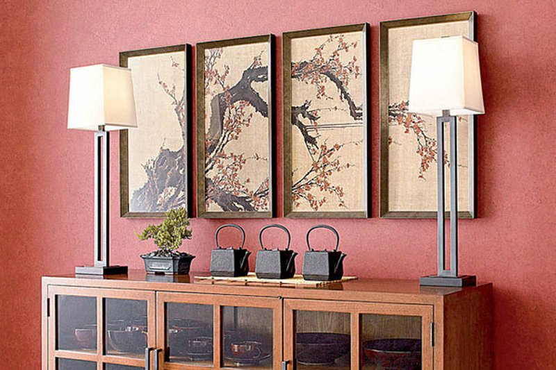 A pair of antiqued bronze lamps in a spare, linear design anchor a dining buffet. The 31.5-inch high lamps cost $298 for the pair at Crate & Barrel.

