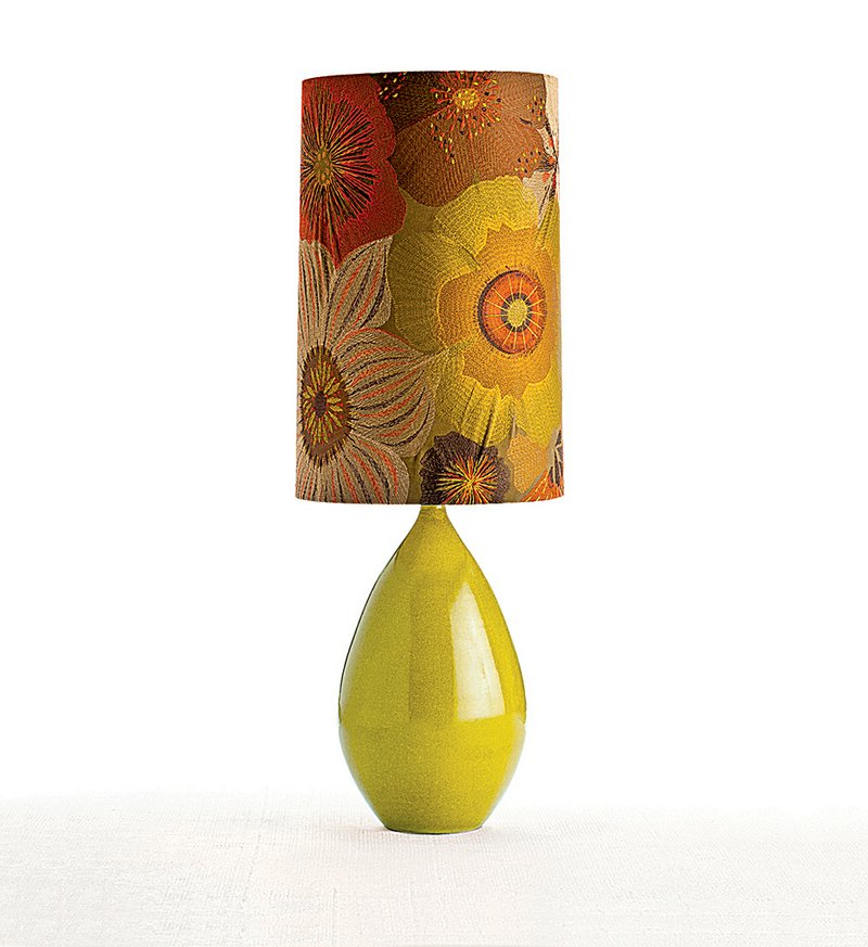 This lamp from Arteriors Home will add a bit of sunshine to a neutral interior, from its citrusy ceramic base to its autumn floral hand-embroidered shade. The proportions are harmonious with the oversize scale of the pattern. It sells for $555.

