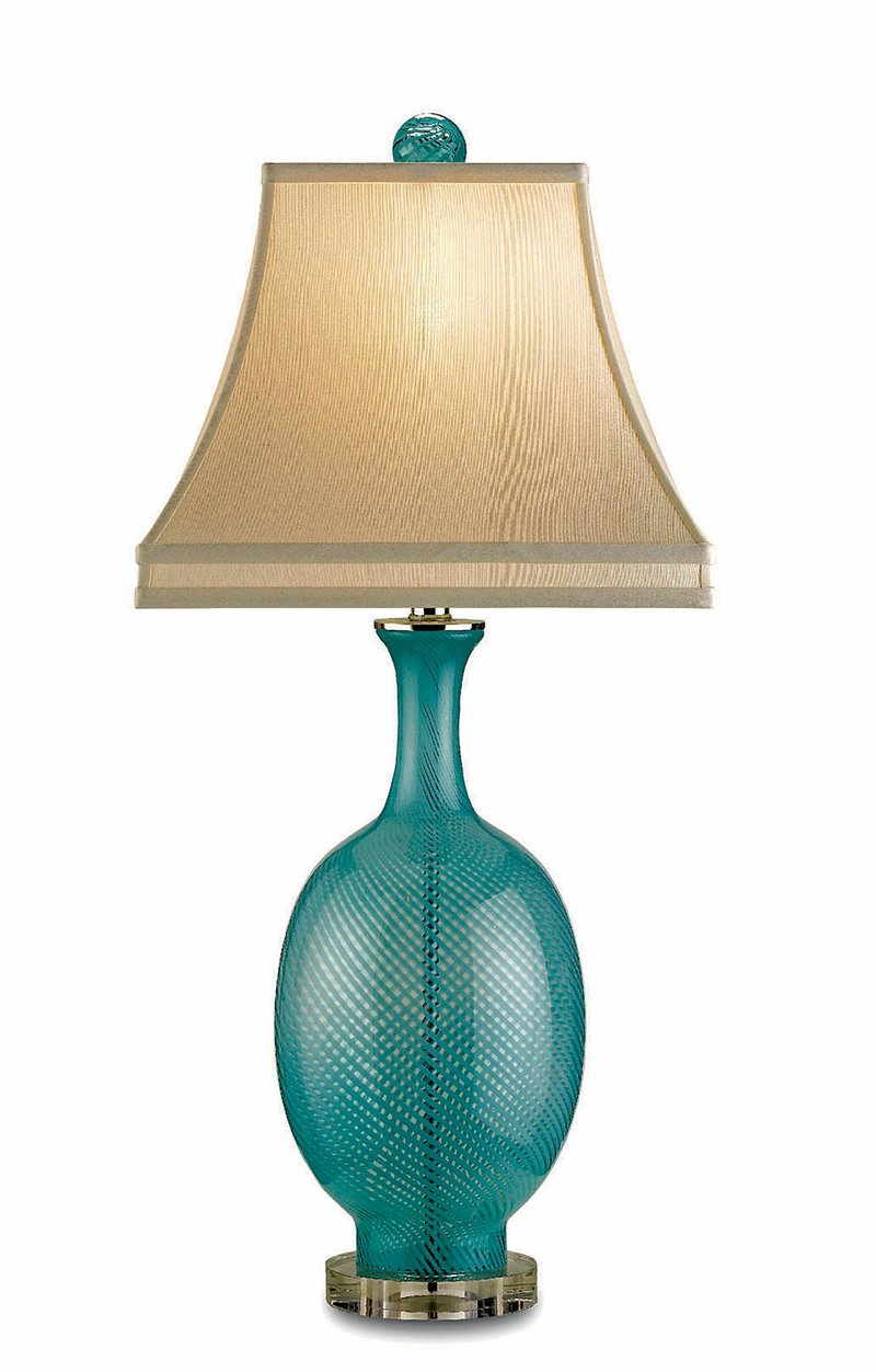 Aqua blown glass (above) Artois table lamp from Currey & Co. stands 31 inches tall on a Lucite base. Its suggested retail price is $550. 