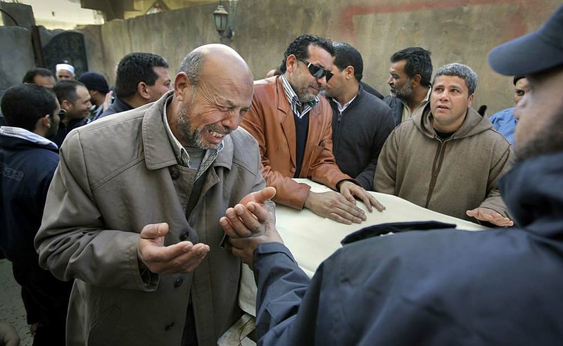 Mourners attend Saturday’s funeral in Tripoli, Libya, for Anwar Algadi, 44, who was killed Friday when forces loyal to Moammar Gadhafi opened fire on protesters. The slain man’s death certificate listed the cause of his demise as “receiving a live bullet to the head,” his brother said. 