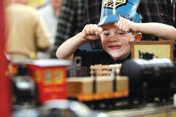  Timothy Russeau, 7, of Decatur reacts Saturday while getting to take the controls of a G-scale model train displayed by the Northwest Arkansas Railway Society during the annual Great Northwest Arkansas Model Train Show in Bentonville. Timothy attended the event with his father, Jonathan. For more photos go to photos.nwaonline.net.
