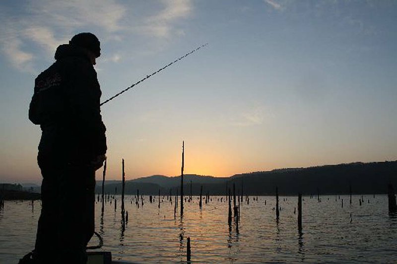 Gary Hubble of North Little Rock greets a late winter sunrise Saturday fishing for bass at Lake Ouachita in an Anvil Jaw Bass Club tournament.

 
