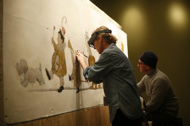 In this Jan. 31, 2011 photo, mural paintings conservator Cassie Myers and conservation technician Lee Dunsmore with Milner + Carr Conservation LLC perform a conservation treatment on Maurice Sendak's 1961 The Chertoff Mural at the  Rosenbach Museum & Library in Philadelphia. 
