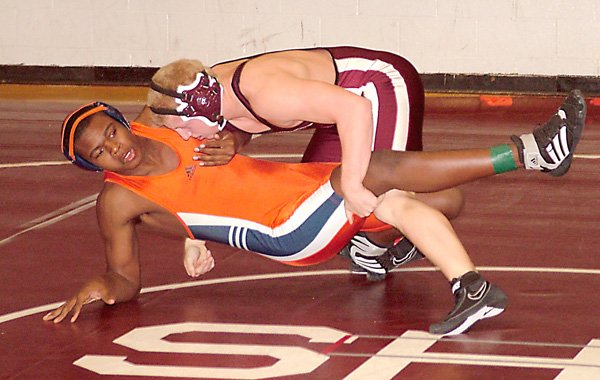 Tanner Coy made quick work of an opponent during wrestling competition in Gentry on Dec. 17. Coy took first in the 160 pound weight class in Gentry and first at the state level last weekend.