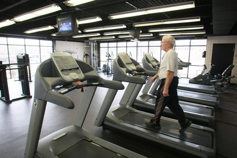 Bob Fairchild works out Wednesday at the Johnny and Sharon Heflin YMCA Family Center in North Little Rock. The Heflin YMCA has 30 employees, most of those part-time. 