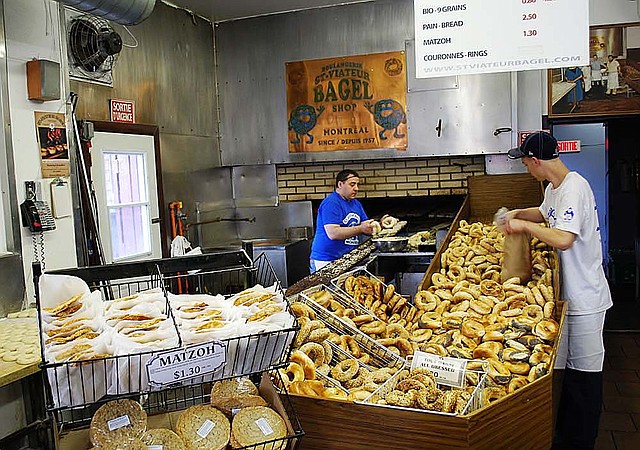 Bakers at St. Viateur Bagel Shop prepare to fill another day’s order. The shop has been a fixture in Montreal since 1957. 