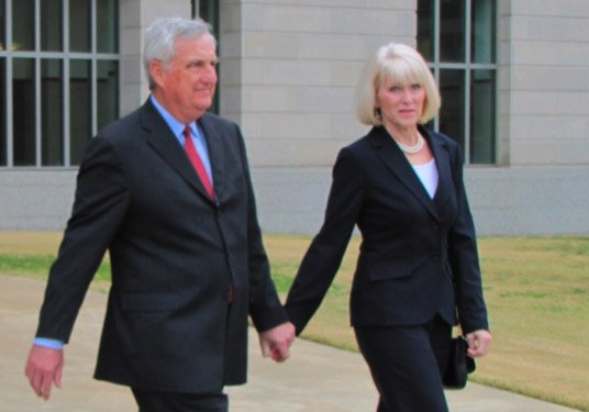 Lu Hardin and his wife, Mary, leave the federal courthouse in Little Rock on March 7 shortly after Lu Hardin entered guilty pleas on charges of wire fraud and money laundering.