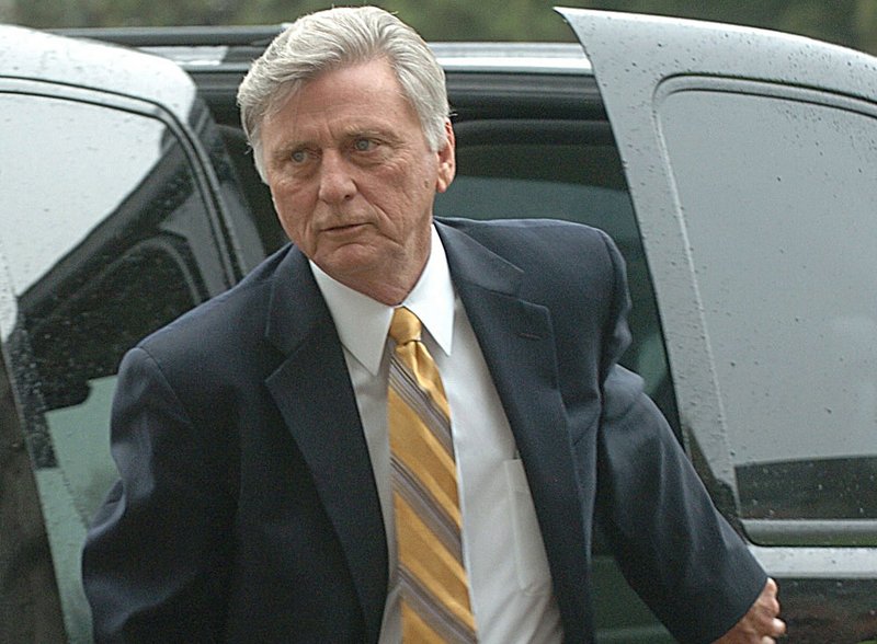 Gov. Mike Beebe arrives Tuesday at the state Capitol, where he told sponsors of House Bill 1895 of his concerns about language in the bill. 