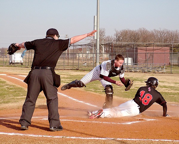 Pulled away from the plate by the throw, Gentry catcher Kolby Rankin can't get a quick enough tag on a Pea Ridge base runner during play in Gentry on Friday.