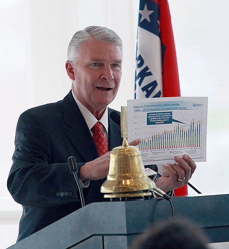 James Lee Witt, former director of the Federal Emergency Management Agency during President Bill Clinton’s term, uses a chart of the most costly disasters since 1980 to illustrate points he was making during a lecture March 16, 2011, at the Clinton Presidential Center in Little Rock. 