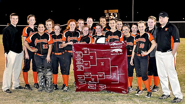 Coaches Taos Jones, right, and Randall Hunt, with the Lady Lions who won the Siloam Springs softball tournament pose for a photo. Team members are Kate Stidham, Kendra Greenhaw, Megan Ward, Natasha Ward, Desirae Fisher, Kyndra Meeker, Adriana Olvera, Melanie Bunch, Charmayne Shelley, Samantha Pruitt, Ashleigh Horn, Tanner Bryson, Taylor West, Shyanne Nichols, Nicole Springer, Breanna Sullivan and Destaney Wishon.