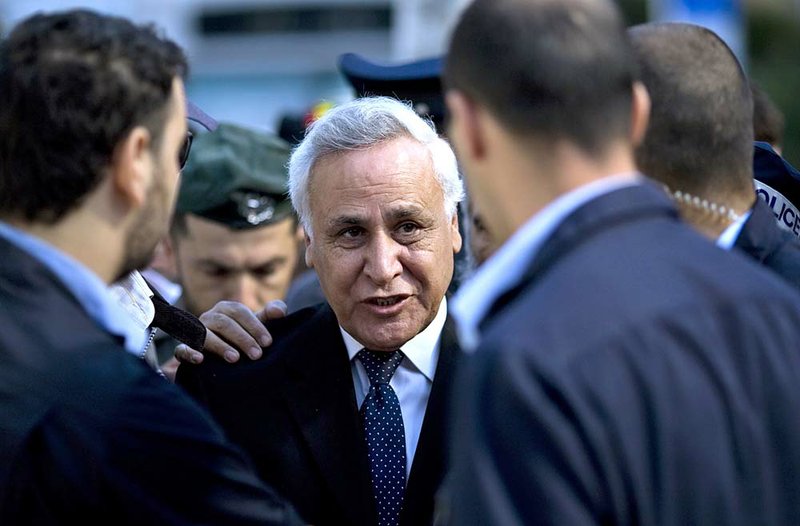  Former Israeli President Moshe Katsav, center, arrives at a court in Tel Aviv, Tuesday, March 22, 2011. A Tel Aviv court is set to sentence a former Israeli president convicted of rape. Katsav faces up to 16 years in prison when his sentence is handed down Tuesday. He said he is innocent. 