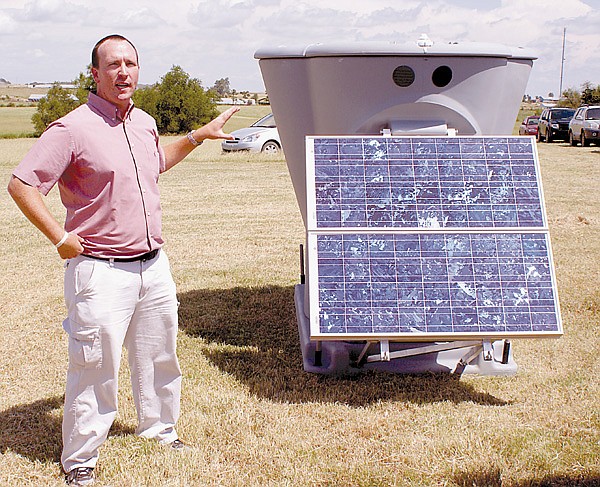 Nathan Wilson, founder and manager of Winds of Change, explained the use of a Triton Wind Profiler in a hay field between Gentry and Decatur in August of 2009. The device measured wind direction and wind speeds at 600 meters above ground and was the first step toward the construction of a wind farm in the Gentry and Decatur area. On Monday, Wilson said that, after one year, the wind measuring device showed wind speeds were 10 to 20 percent better than expected.