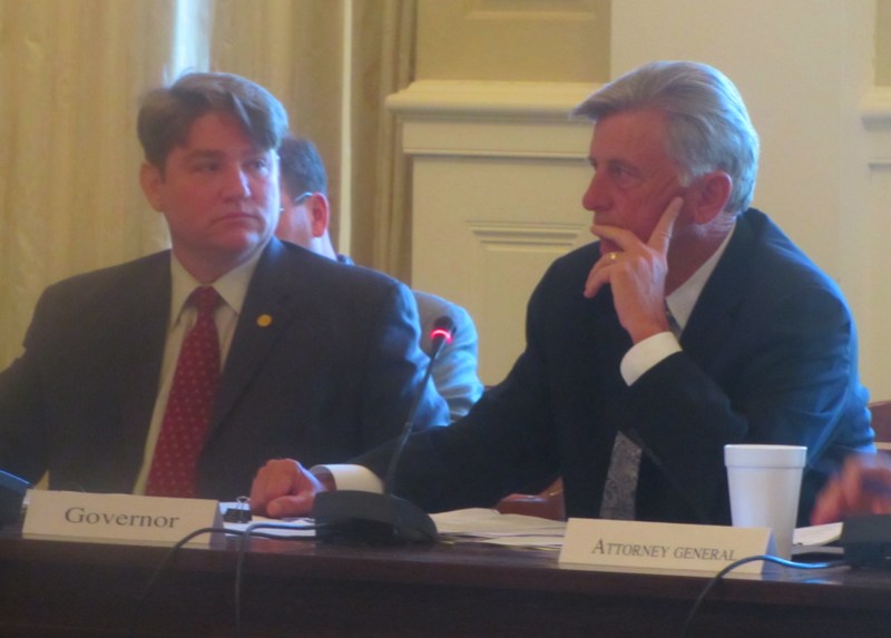 Secretary of State Mark Martin and Gov. Mike Beebe participate in a meeting of the board of apportionment Wednesday at the state Capitol.