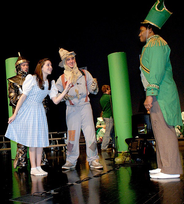 Dorothy (Rachael Morris), Tinman (Adam Smith), and Scarecrow (David Carnahan) are confronted by Guard (Kahlief Steele) in the "Wizard of Oz" production. Photos by Dodie Evans