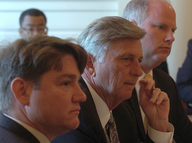 Arkansas Board of Apportionment members (from left) Secretary of State Mark Martin, Gov. Mike Beebe and Attorney General Dustin McDaniel meet Wednesday in the state Capitol. 