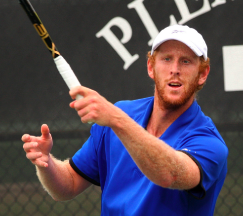 Second-seeded Chris Guccione returns a shot during Thursday’s 6-3, 6-2 victory over Bjorn Propst to advance to the quarterfinals of the St. Vincent Tour de Paul tournament at Pleasant Valley Country Club in Little Rock. 