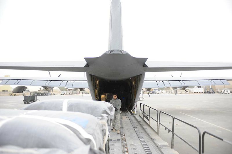 Bundles of supplies are loaded onto a 772nd Expeditionary Airlift Squadron C-130J Hercules at Kandahar Air Base in Afghanistan last week. The bundles are equipped with special parachutes that allow 99 percent of the bundles to be recovered undamaged. 