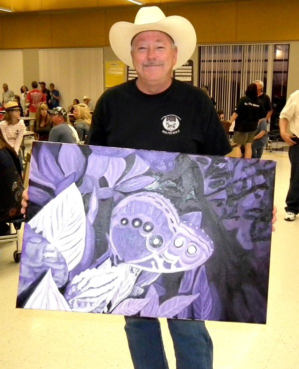 Dale Russow, a heart transplant recipient, bought one of June Wall’s unfinished paintings during the benefit auction on Saturday. Dale and his wife said they had to buy the painting, even when the bidding got very competitive, because it has so much meaning to them. The Russows are eagerly awaiting the day that June can come home and finish their painting.
