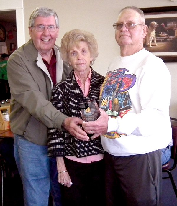 Gene and Norma Wilmoth, left, receive an award April 4 from Chamber of Commerce president Royce Johnson for their lifetime of service in the Decatur community.