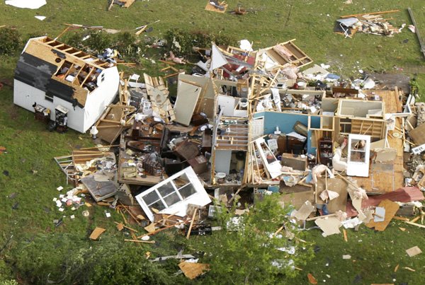 A house lies destroyed in Vilonia, Ark., Tuesday, April 26, 2011, after a tornado hit the area late Monday. More severe weather and possible tornadoes struck Arkansas Tuesday night while residents across the state cleaned up from Monday's storms.