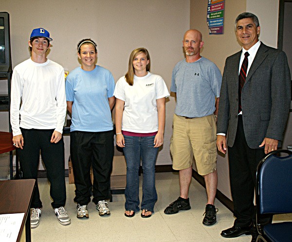 Mitchell Perry, Sienna Shaw and Brittany Booth are pictured with coach Donnie Smith and superintendent Larry Ben.