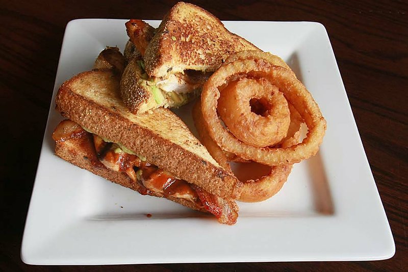   The chipolte chicken sandwich and onion rings at the Tavern Sports Grill, 17809 Chenal Pkwy. in Little Rock, April 25.