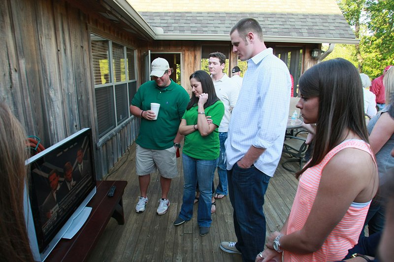 Former Arkansas quarterback Ryan Mallett (second from right) watches the NFL Draft preview show at a hunting lodge near Stuttgart on Thursday. 