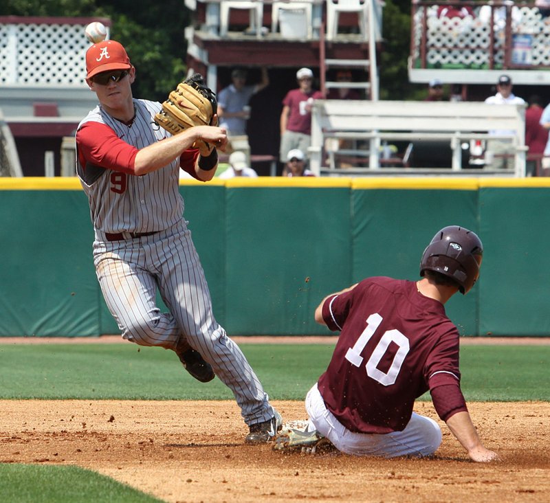  Alabama shortstop Jared Reaves, left, tags out Mississippi State's C.T. Bradford in the first game of an SEC doubleheader in Starkville, Miss., Saturday, April 30, 2011. Alabama won 5-4 in 10 innings. 