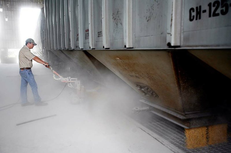  Arkansas Democrat-Gazette/AMELIA PHILLIPS
Casey Karr, of Elkins, unloads corn from Marna, Minnesota, from a train into the Tyson feed mill Tuesday afternoon in Springdale.  One car holds 220,000 pounds, and they unloaded about 30 cars worth of corn in about 16 hours.
061708