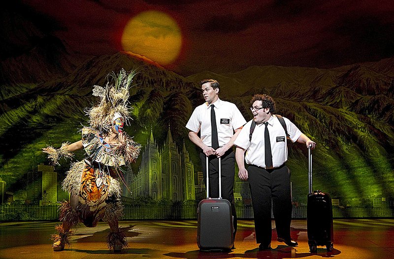 In this file theater publicity image released by Boneau/Bryan-Brown, from left, Rema Webb, Andrew Rannells and Josh Gad perform in "The Book of Mormon" at the Eugene O'Neill Theatre in New York. "The Book of Mormon" nabbed a leading 14 Tony Award nominations Tuesday morning, earning the profane musical nods for best musical, best book of a musical, best original score, two leading actor spots and two featured actor nominations.    