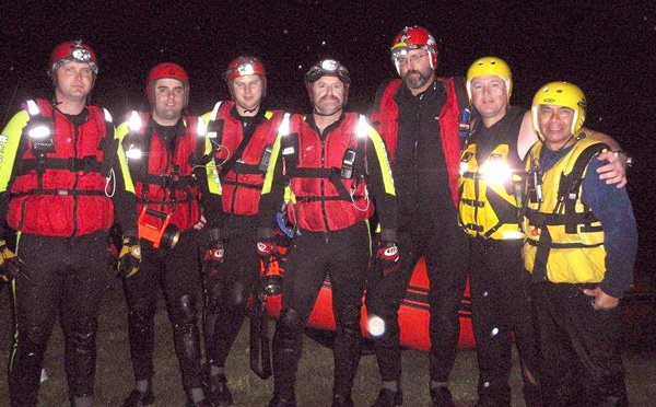 Rob Holland, Blake Webb, Gene Holland, Delton Bush, Kevin Higgins, Charles Strickland and Steve Camporna pose for a group photo following their harrowing rescue experiences on the Illinois River last week. 