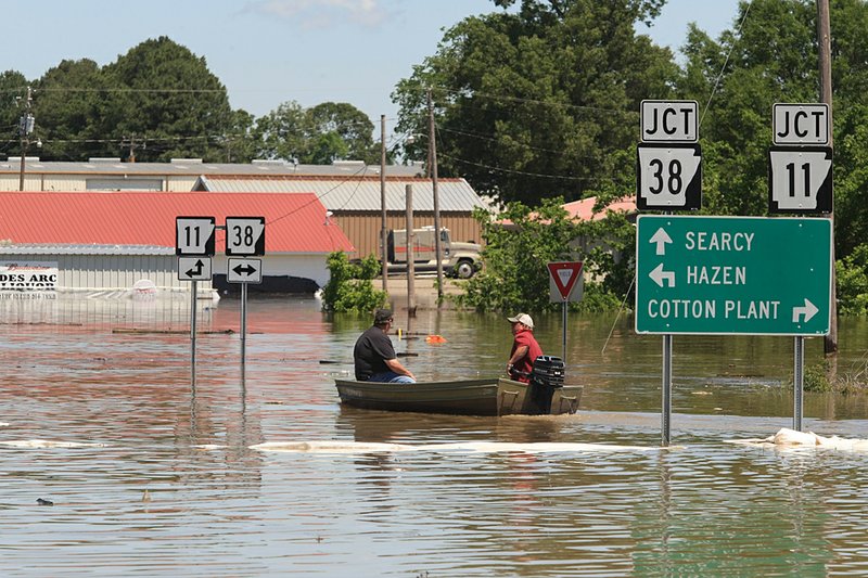 Arkansas Democrat-Gazette/STATON BREIDENTHAL 5/6/11
A boat is the only way to navigate parts of Des Arc as water from the White River continues to rise.