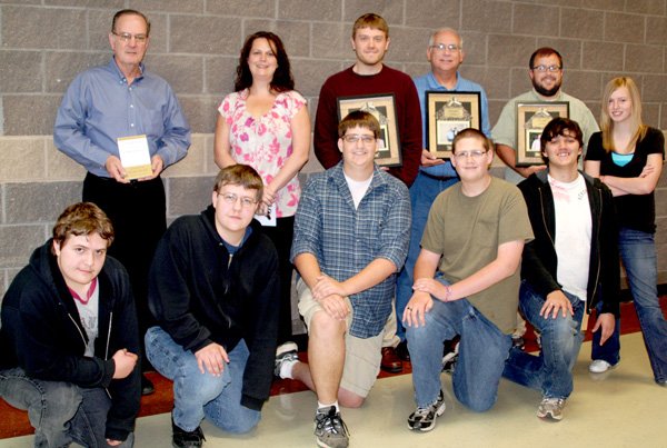 Students at Gravette High School honored their teachers. Students, from the left in the foreground, are Daniel Dalton, Sam Dalton, Aaron Homer, Keil Homer, Joel Coy and Stephanie Burch. Teachers honored, back row, are Vic Clouse, Physical Science/Counselor; Angela Scott, Health Occupations; Matt Skrocki, English; Harry Almond, Business; and Jaron Porter, German/Civics. 