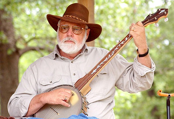 Jeff Davis plays a favorite old time tune on one of his handcrafted banjos that features an inlay style called the “tree of life.”
