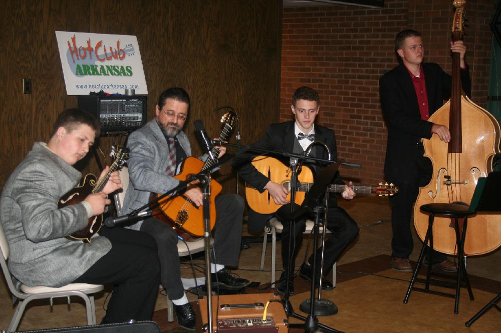 Member of Hot Club Arkansas perform.