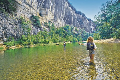 Anglers enjoy a day of fly fishing on the Buffalo River. While many people associate fly fishing with trout, species such as bass, bluegills, crappie and even catfish can be enticed with flies as well.