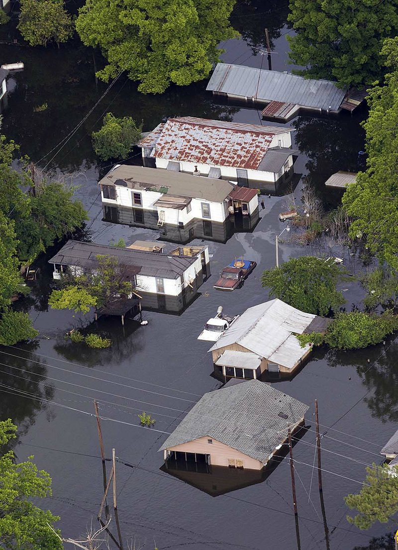  Floodwaters surround the Kings community of Vicksburg, Miss., Thursday, May 19,  2011. The floodwaters from the Mississippi river are expected to crest Thursday in Vicksburg.   For thousands of people forced from their homes by the rising Mississippi River, life has become a tedious waiting game: waiting for meals at shelters, waiting for the latest word on their flooded homes, waiting for the river to fall.  